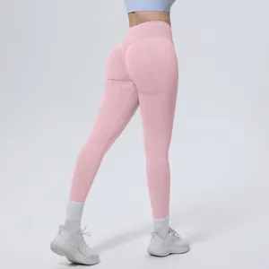 Back view detail of high waisted seamless pink yoga pants with booty lifting design