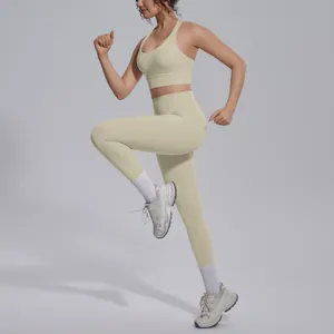Pale yellow yoga set showing flexible fit with sports bra and high-waisted leggings