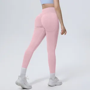 Rear view of pink high waist seamless yoga pants showing the hip lifting detail