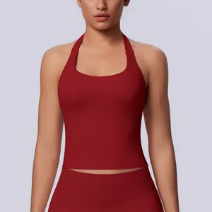 Close-up front view of a seamless red halter neck sports tank top for women's fitness