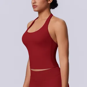 Detail view of a seamless red halter neck sports tank top for yoga and fitness training.
