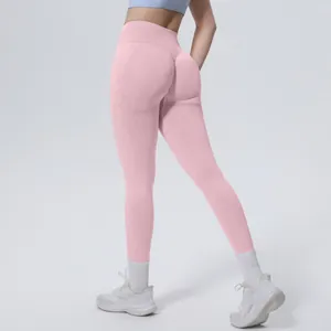 Back view of pink seamless high-waist yoga leggings showing butt-lifting effect