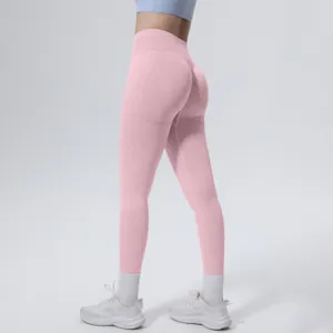 Detail view of pink high-waisted seamless washed yoga leggings with butt lift contouring
