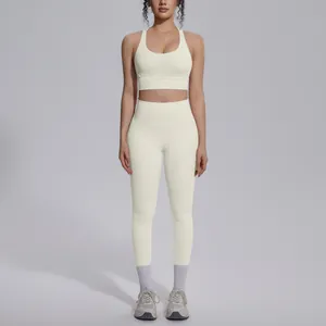 Detailed view of cream nylon yoga set featuring high-waist leggings and sports bra.