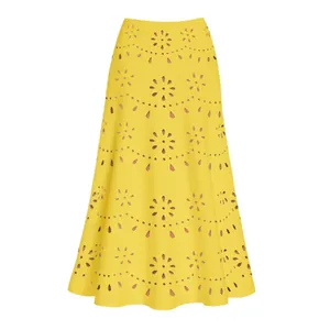 Detailed view of yellow A-line skirt with laser-cut hollow-out floral patterns