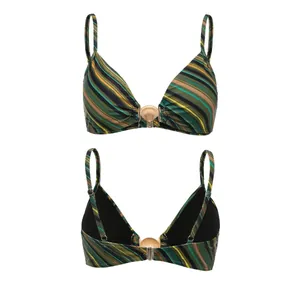 Detail view of striped bikini top featuring a gold shell-shaped metallic clasp.