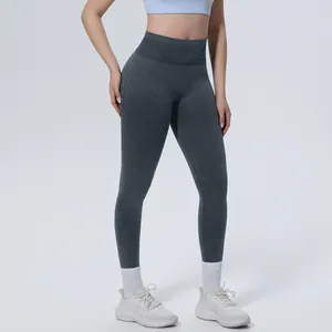 Detailed shot of seamless high-waist yoga leggings showing washed texture on model
