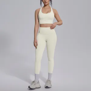 Full view of cream-colored high-waist yoga leggings and sports bra set for gym fitness