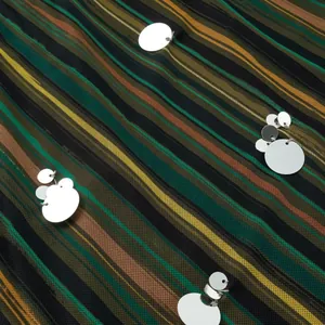Close-up of multicolored striped swimsuit fabric with silver sequin embellishments