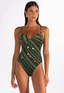 Close-up view of a green striped one-piece swimsuit featuring elegant silver sequin details.