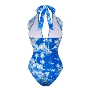 Detailed view of blue coconut island print one-piece swimsuit with ruffle halter
