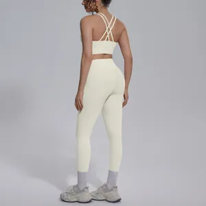Back view of premium cream cross-back yoga sports bra and high-waisted leggings set
