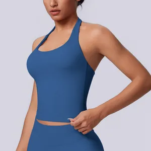Close-up of seamless halter neck sports tank top in vibrant blue yoga wear.