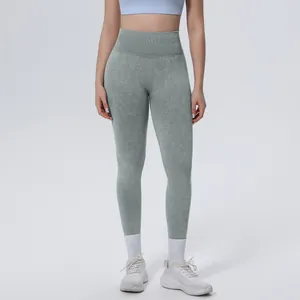 Detail showing seamless high waist yoga leggings with unique sage green acid wash texture
