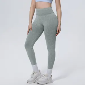 Close-up detail of high-waisted seamless washed yoga leggings in a sage green color.