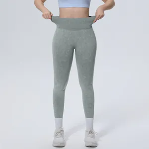 Detailed view of seamless high-waisted washed yoga pants with wide ribbed waistband