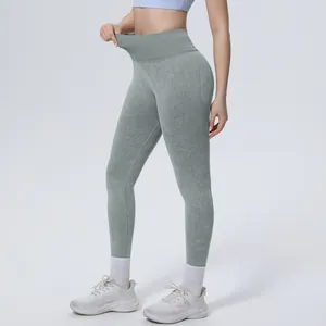 Close-up detail of high-waist washed seamless yoga pants showing waist elasticity and texture