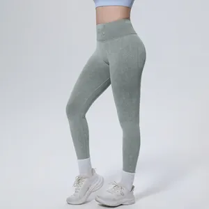 Detail view of green high-waist seamless washed yoga pants with supportive waistband
