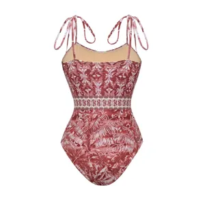 Detailed view of ethnic tropical print one-piece swimsuit with tie-shoulder straps