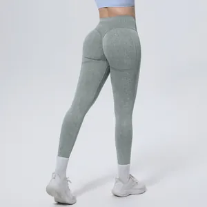 Back view detail of seamless high-waisted washed yoga leggings in sage green for women