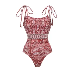 Red and white ethnic print one-piece swimsuit with adjustable beaded tassel shoulder ties