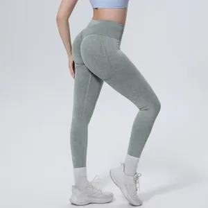High-waist seamless washed green yoga leggings featuring a peach butt lift effect