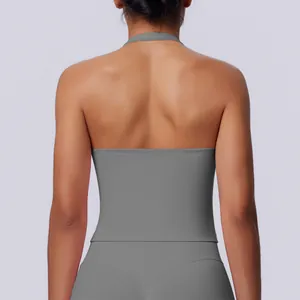 Detailed back view of a seamless grey halter-neck sports top for fitness and yoga