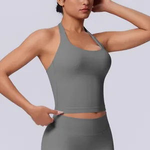 Detailed view of a grey seamless halter-neck sports tank top for women's fitness