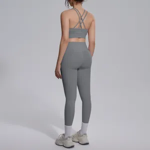 Detailed back view of a grey cross-back sports bra and leggings yoga set for women
