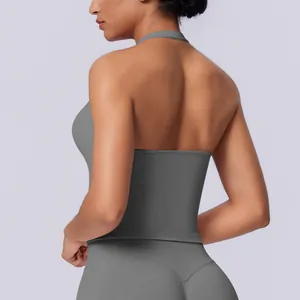 Detailed view of women's grey seamless halter-neck sports top featuring open back design