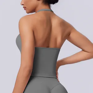 Back view of a grey seamless halter neck sports top showing a cross-back design.