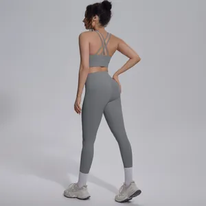 Detailed back view of a grey cross-back sports bra and high-waisted yoga leggings set