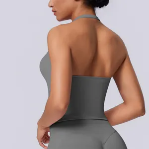 Detailed macro view of a grey seamless halter-neck sports tank top with a deep open back