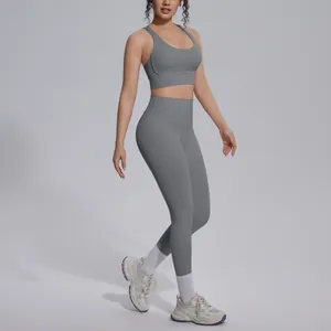 Side view of woman wearing grey naked-feel yoga set with high-waist leggings
