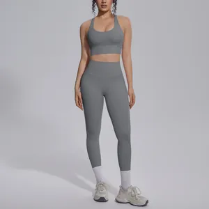 Grey two-piece yoga set featuring sports bra and high-waisted leggings for fitness.