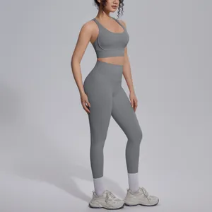 Full-body view of a grey two-piece yoga set with racerback bra and high-waist leggings