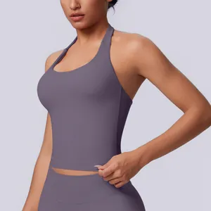 Close-up detail showing the seamless texture and halter neck design of a purple sports top