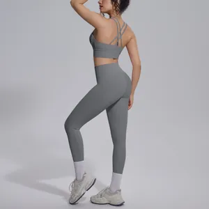 Detailed side-back view of grey cross-back yoga sports bra and high-waisted leggings set