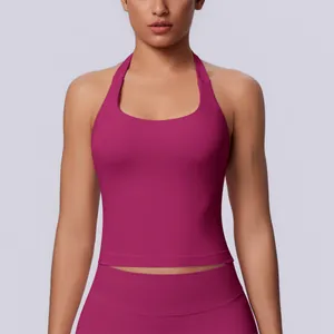 Close-up of a seamless magenta halter neck sports tank top with tight fit for yoga