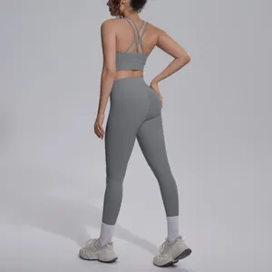 Detailed back view of a grey high-waist yoga set featuring a cross-strap sports bra