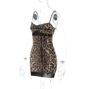 Close-up detail of a sexy leopard print sequin bodycon mini dress with mesh trim
