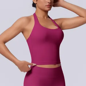 Detail view of fuchsia seamless halter sports top for yoga and fitness training.