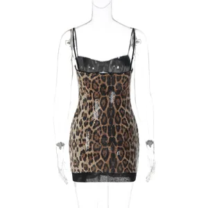 Close-up view of back detail for a sequined leopard print mini dress with mesh hem.