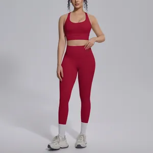 Close-up front view of a red two-piece seamless yoga set for women's fitness and gym wear.
