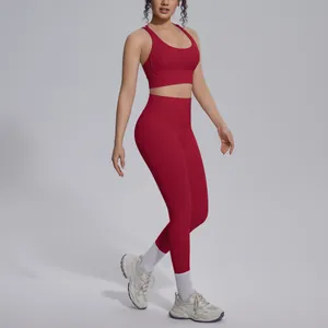 Red seamless yoga set with criss-cross sports bra and high waist leggings for fitness