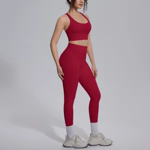 Red two-piece nylon yoga set featuring a cross-back sports bra and high-waisted leggings.