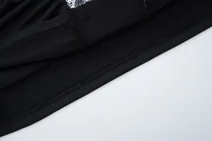 Close-up detail of high-quality stitching and sequins on a black sexy halter top