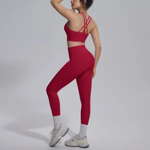 Back view of a red yoga set featuring cross back sports bra and high waist leggings