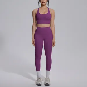Close-up detail of a purple high-waisted yoga set with a racerback sports bra.