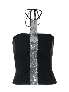 Detailed view of a black halter neck tube top featuring silver sequin and pleats